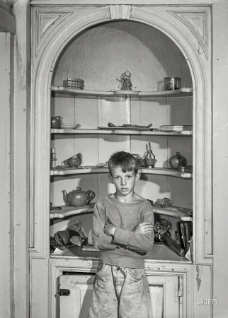Photo showing: Cupboard-Cornered -- August 1941. One of the children of Ernest Johnson, FSA client. Vernon, Vermont.