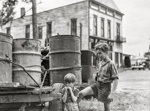 Photo showing: Pine Camp -- August 1941. Two of the children of Mr. Earl J. Brown helping to get the last few
belongings out of their farm in the Pine Camp expansion area near Watertown, New York.