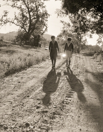 Photo showing: School Days -- September 1941. Two of the Gaynor boys walking to school near Fairfield, Vermont.