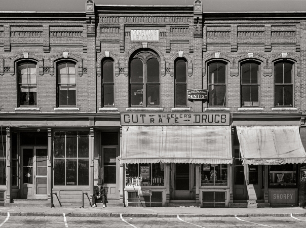 Photo showing: Cut Rate Drugs -- September 1941. South Royalton, Vermont. Storefronts on the main street.