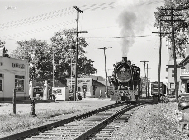 Photo showing: Enosburg Falls -- September 1941. Small town scenes in Vermont. Locomotive passing through Enosburg Falls.