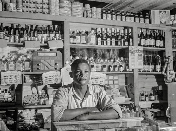 Photo showing: Everything Must Go. -- December 1941. Bayamon, Puerto Rico. Proprietor of a small general store,</br />
which will soon be evacuated because it is in an area to be taken over by the Army.