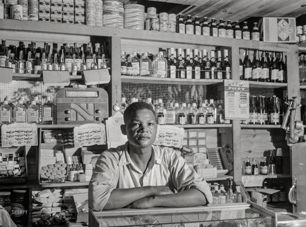 Photo showing: Everything Must Go. -- December 1941. Bayamon, Puerto Rico. Proprietor of a small general store,</br />
which will soon be evacuated because it is in an area to be taken over by the Army.