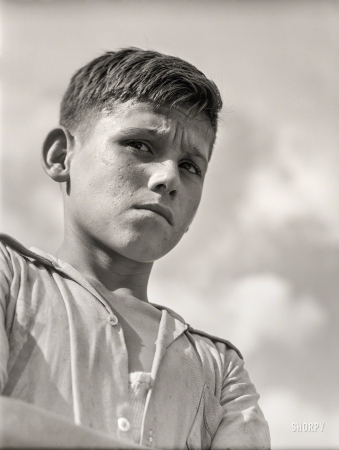 Photo showing: What, Me Worry? -- January 1942. San Sebastian, Puerto Rico. Boy who was playing in the street.