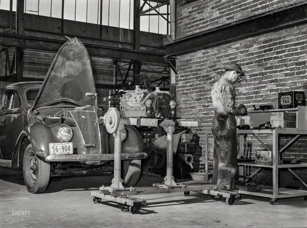 Photo showing: In the Shop -- May 1939. Repairing automobile motor at the FSA warehouse depot in Atlanta, Georgia.