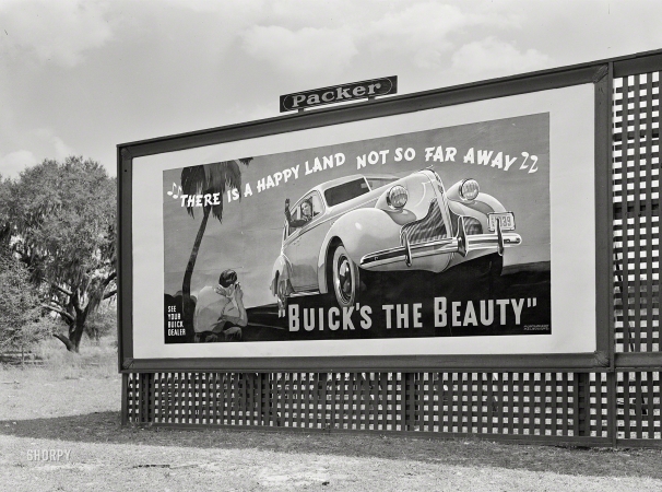Photo showing: There Is a Happy Land -- May 1939. Signboard along highway in Alabama.