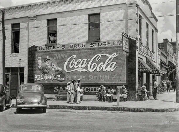 Photo showing: Hunters Drug Store -- Spring 1939. General scene, main street. Greensboro, Greene County, Georgia.