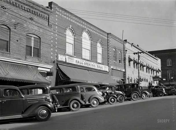 Photo showing: The Outlet Store -- November 1939. Main street in South Boston, Halifax County, Virginia.