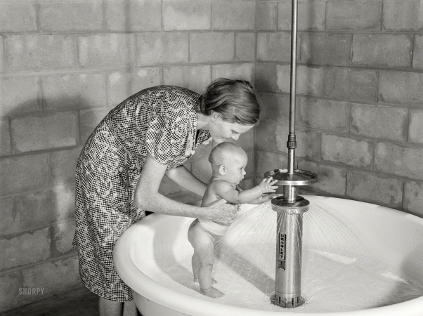 Photo showing: Baby Shower -- June 1940. Belle Glade, Florida. Showers for babies are provided in the
utility building for members of the Osceola migratory labor camp.