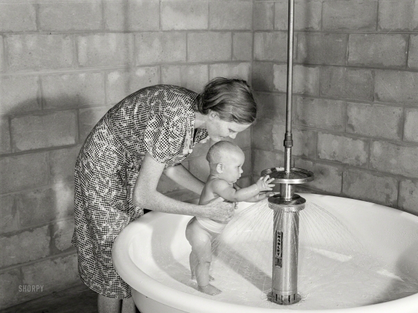 Photo showing: Baby Shower -- June 1940. Belle Glade, Florida. Showers for babies are provided in the
utility building for members of the Osceola migratory labor camp.