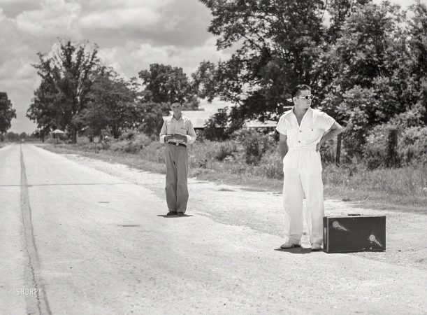 Photo showing: Normal -- June 1940. College boy trying to 'thumb' a ride home over the weekend near Natchitoches, Louisiana.