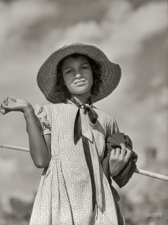 Photo showing: Gone Fishing -- June 1940. Melrose, Natchitoches Parish, Louisiana. Daughter of mulatto family returning home after fishing in the Cane River.