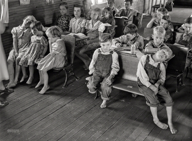 Photo showing: Class of 1940 -- August 1940. Overcrowded conditions and poor equipment in rural mountain school in Breathitt County, Kentucky.