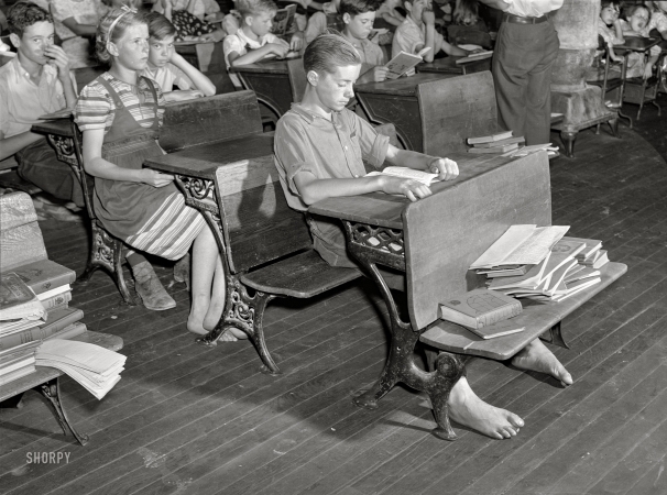 Photo showing: Barefoot Scholars -- September 1940. One-room schoolhouse showing overcrowded conditions. Breathitt County, Kentucky.