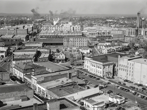 Photo showing: Cigarette City -- October 1940. Durham, North Carolina. Five Points, center of city, with Chesterfield cigarette factories in background.