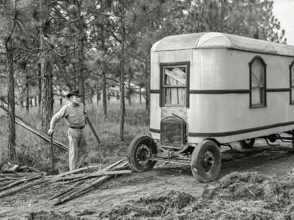 Photo showing: Fordable Housing -- December 1940. Alexandria, Louisiana. Construction worker's
trailer (home-made house car). He has a job at Camp Livingston.