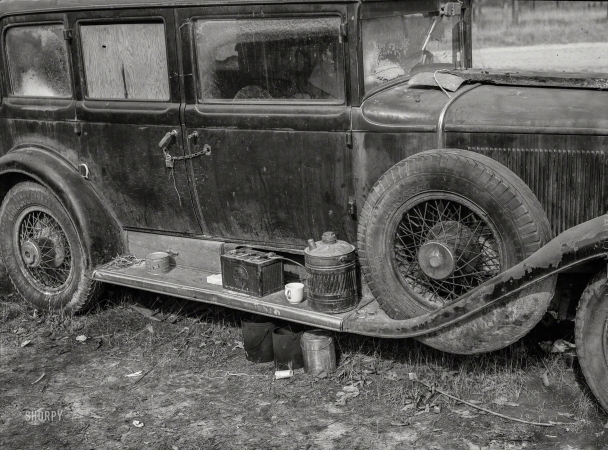 Photo showing: Broken In -- December 1940. Close-up of car from Mississippi used for sleeping as well
as shelter and traveling.On highway near Camp Livingston. Alexandria, Louisiana.