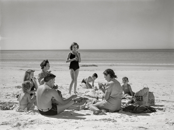 Photo showing: White Sands -- January 1941. Guests of Sarasota trailer park picnicking at the beach.