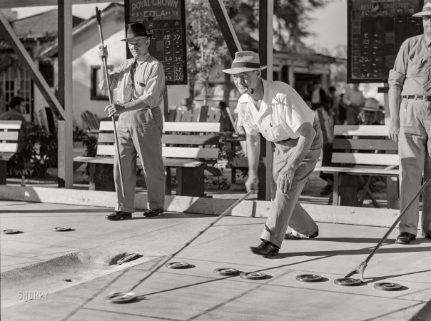Photo showing: Winter Games. -- January 1941. Guests at Sarasota, Fla., trailer court playing shuffleboard.
