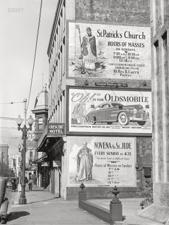 Photo showing: Difficult Cases -- January 1941. Billboards on side of building in New Orleans, Louisiana.