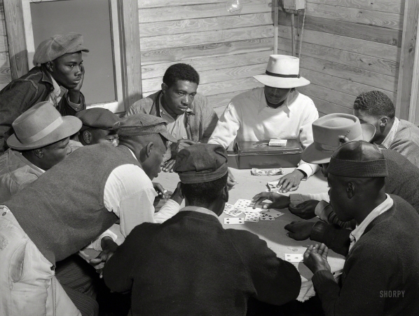 Photo showing: Florida Skin -- February 1941. Migratory laborers and vegetable pickers playing a game of 'skin'
in back of juke joint and bar in the Belle Glade area of south central Florida.