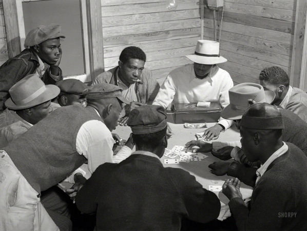 Photo showing: Florida Skin -- February 1941. Migratory laborers and vegetable pickers playing a game of 'skin'
in back of juke joint and bar in the Belle Glade area of south central Florida.