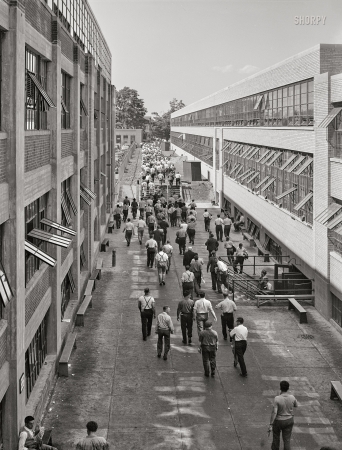 Photo showing: Shift Change. -- June 1941. Change of shift at Pratt & Whitney United Aircraft. East Hartford, Connecticut.