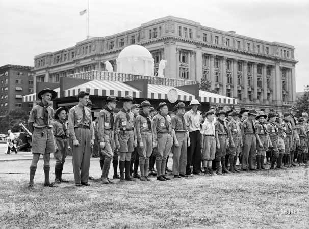 Photo showing: A Scouting Outing -- July 1941. Boy Scouts learning about Army equipment in Commerce Square, Washington, D.C.