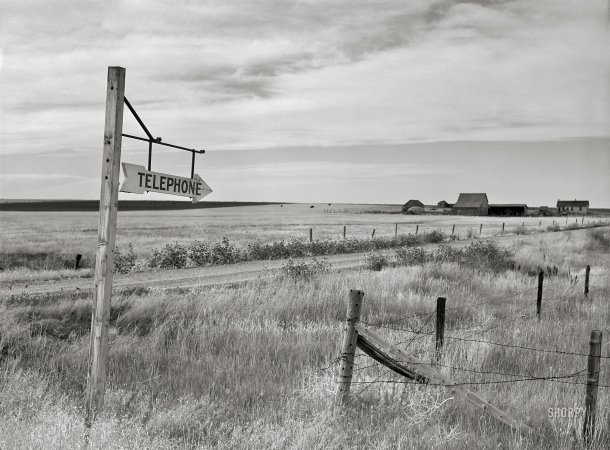 Photo showing: Long-Distance -- September 1941. Telephone sign along highway. Judith Basin, Great Falls, Montana.