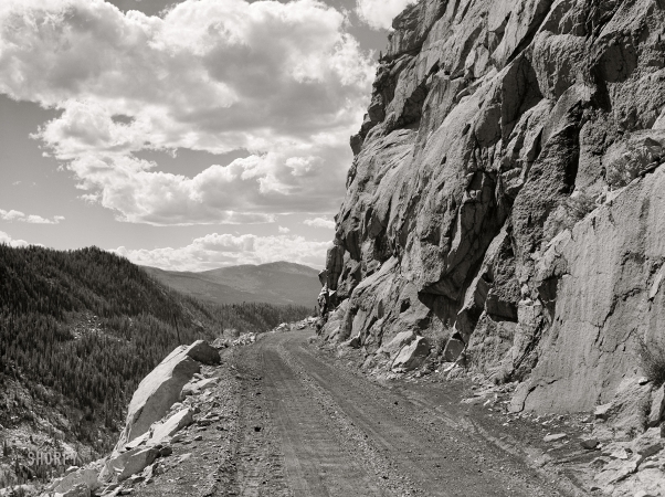 Photo showing: Blind Curve -- September 1941. Road leading out of Carlton Tunnel along bed of old narrow
gauge railroad on the west side of the Rocky Mountains from Leadville, Colorado.