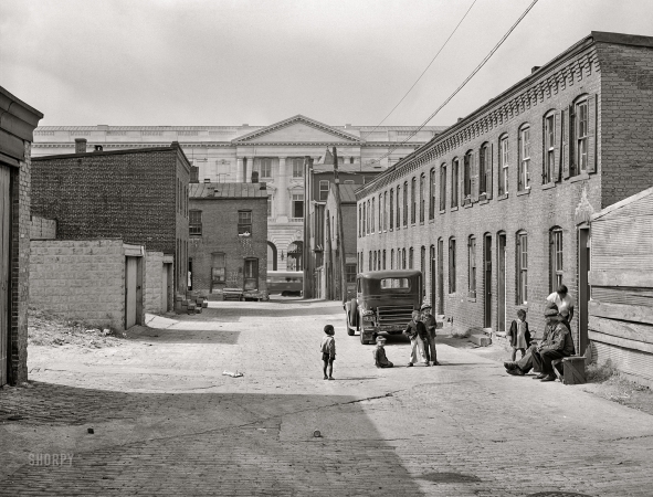 Photo showing: Schotts Alley II -- Washington, D.C. Schoots Court [i.e., Schott's Alley] with Senate Office Building in background.
Four very small dark rooms rent for 15 and 18 dollars per month with water and privy in yard ... 