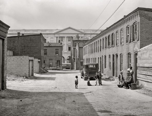 Photo showing: Schotts Alley II -- Washington, D.C. Schoots Court [i.e., Schott's Alley] with Senate Office Building in background.
Four very small dark rooms rent for 15 and 18 dollars per month with water and privy in yard ... 