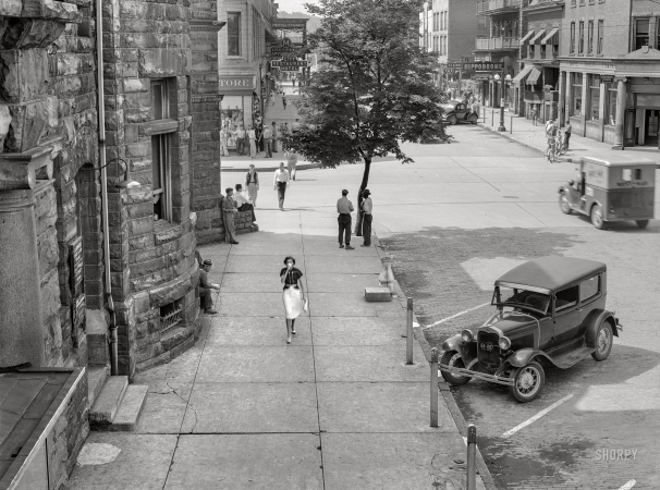 Photo showing: Shady Lady -- June 1939. Shady side of main street. Elkins, West Virginia.