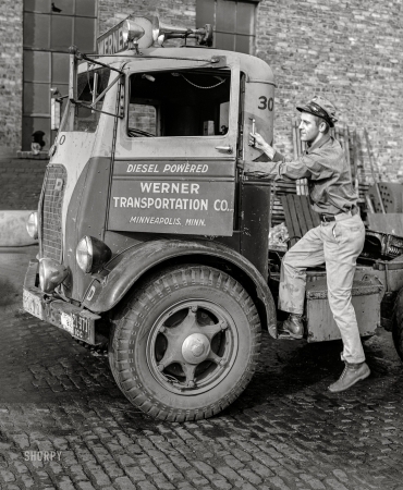 Photo showing: Truckin. -- September 1939. Driver entering cab of truck which has just been cleaned
and checked over in garage preparatory to next trip. Minneapolis, Minnesota.