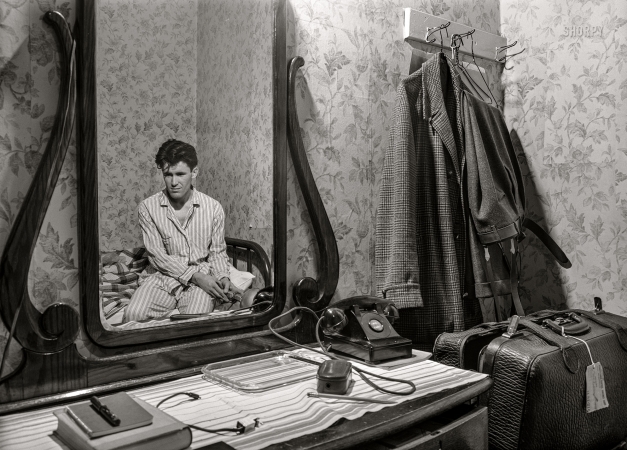 Photo showing: Johnnys Jammies -- April 1940. Another selfie of photographer John Vachon in his Dubuque hotel room.