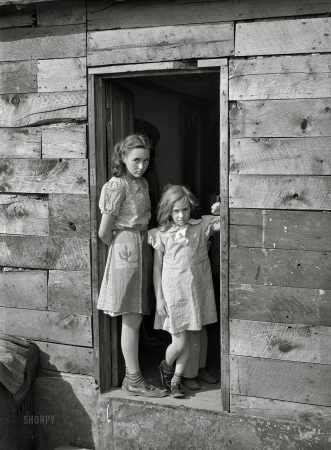 Photo showing: Our House. -- April 1940. Children living in shacktown
along Mississippi River bottom. Dubuque, Iowa.