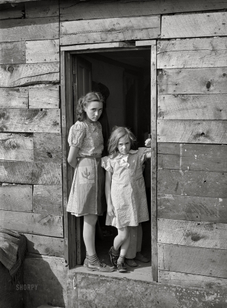 Photo showing: Our House. -- April 1940. Children living in shacktown
along Mississippi River bottom. Dubuque, Iowa.