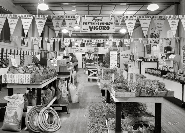Photo showing: Seed and Feed. -- April 1940. Earl May seed store. Marshalltown, Iowa.