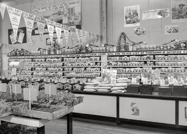 Photo showing: The Long, Long Slogan -- April 1940. Earl May seed store in Marshalltown, Iowa.