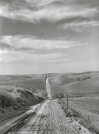 Photo showing: The Far Horizon -- May 1940. County road in Western Iowa corn country. Monona County.