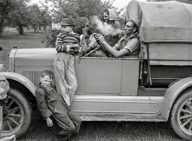 Photo showing: The Cherry Pickers -- July 1940. Berrien County, Michigan. Cherry-picking season. Family of migratory fruit workers from Texas.