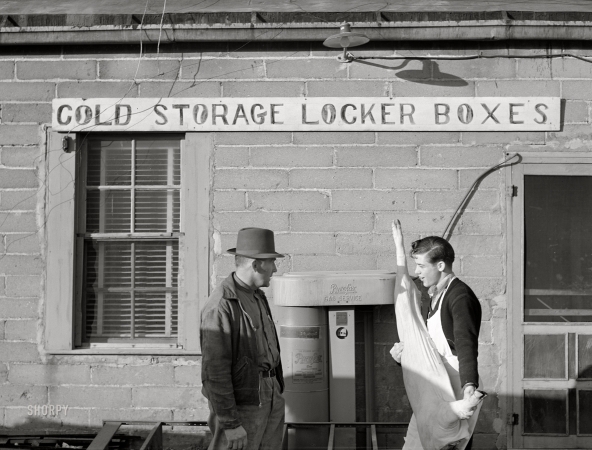 Photo showing: Porksicle -- October 1940. Cooperative cold storage lockers in Casselton,
North Dakota, where farmers bring their own butchered pigs.