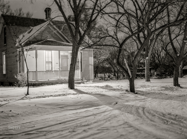 Photo showing: Keep a Light On -- November 1940. Porch light to welcome expected visitors. Pierre, South Dakota.