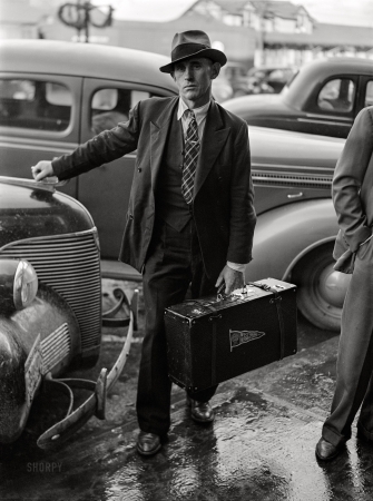 Photo showing: New in Town -- December 1940. Radford, Virginia. Influx of construction workers
to build Hercules Powder Plant. Man just arrived to report for work.