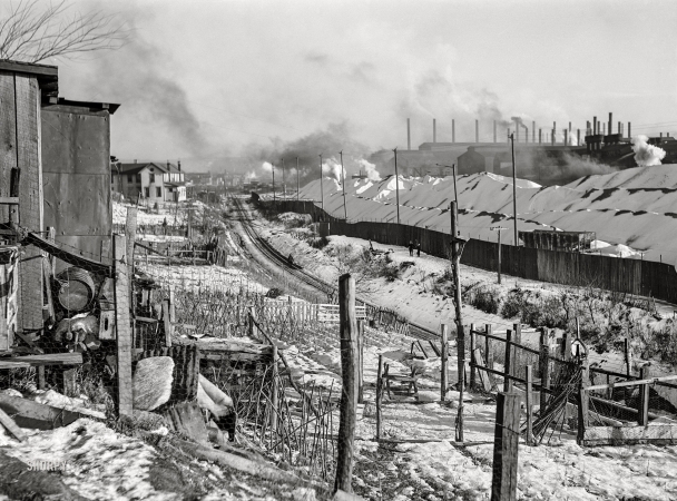 Photo showing: Work, From Home -- January 1941. Midland, Pennsylvania. Backyards of company houses and steel mill.