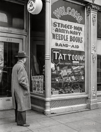 Photo showing: Tattooing and Curios -- March 1941. Tattoo parlor on West Main Street. Norfolk, Virginia.