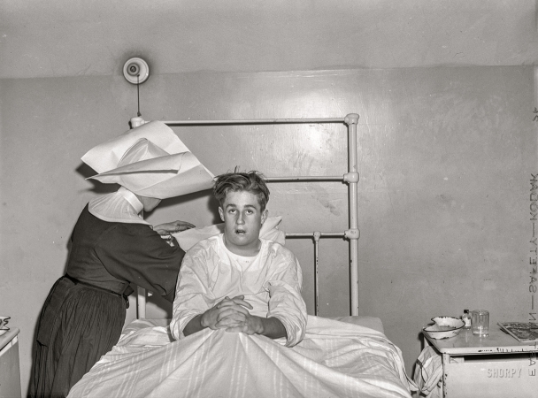 Photo showing: On the Mend. -- March 1941. Boy from Maryland in charity ward, Saint Vincent's Hospital. Norfolk, Virginia.