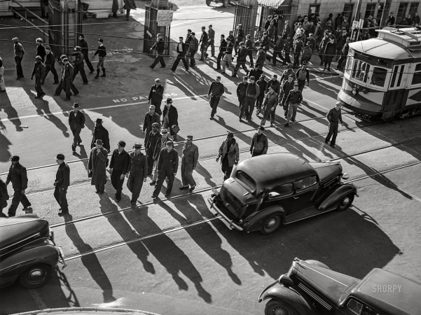 Photo showing: Four OClock Shadow -- March 1941. Newport News, Virginia. Shipyard employees getting out at 4 p.m.