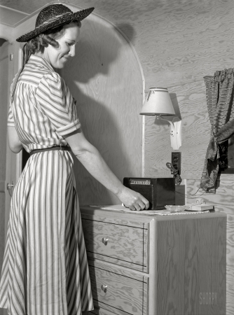 Photo showing: High Fidelity -- June 1941. Tuning in radio in trailer at FSA camp. Erie, Pennsylvania.