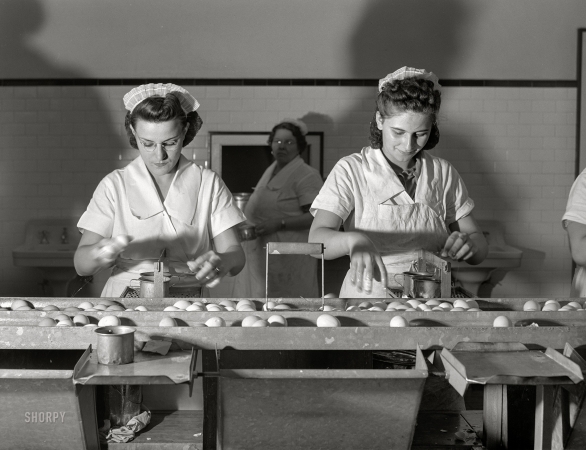 Photo showing: Break an Egg -- July 1941. Breaking eggs in egg breaking plant. Chicago, Illinois.